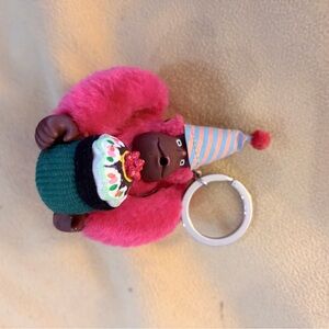Kipling Hot Pink Gorilla Keychain with Striped Party Hat and Cupcake